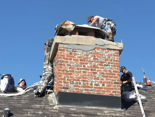 Davie Chimney Sweep installing a custom chimney crown in Davie, FL
