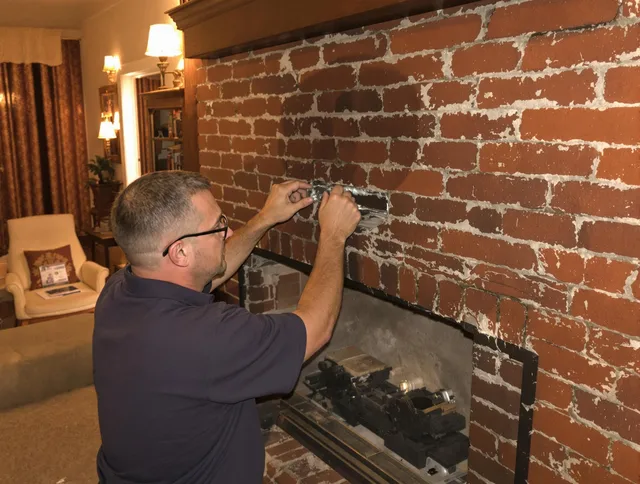 Davie Chimney Sweep expert fixing a fireplace in Davie, FL